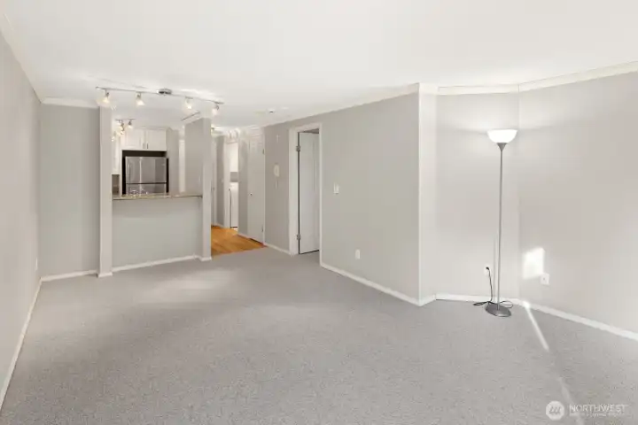 Living Area Looking Toward Kitchen, Eat-In Bar & Entry