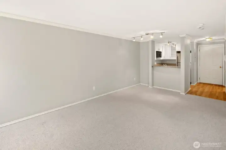 Living Area Looking Toward Kitchen, Eat-In Bar & Entry