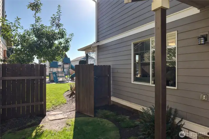 A gate from the yard to the community park.