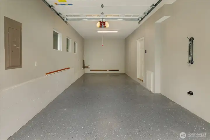 New epoxy garage floor. Great for parking a car or additional space like a home gym.