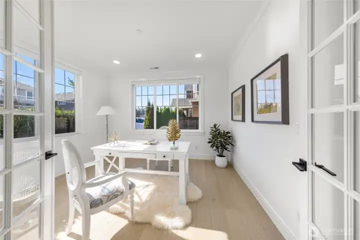 Cheerful, sun-drenched private office off the foyer.