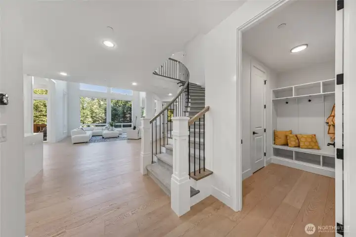 Mud room with closet space and shoe shelves.
