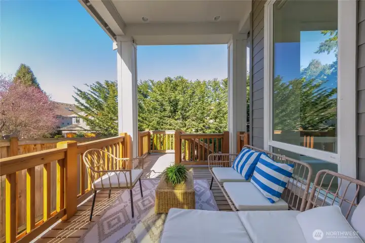 Covered deck with skylight is great for outdoor relaxation.
