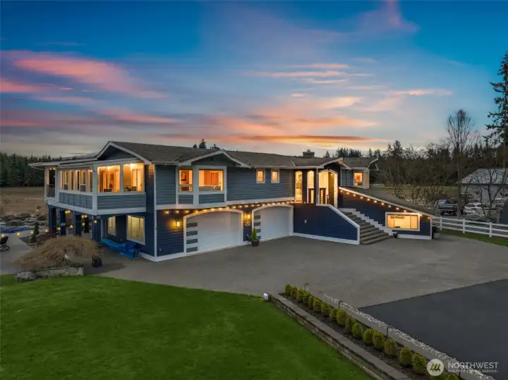 Resort-style living in Lake Stevens! Custom home with mountain views, in-ground pool + hot tub, pool house, and over 2,000 SF of covered outdoor living space.