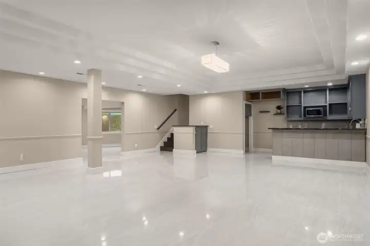 Beautiful marble flooring with a kitchenette.