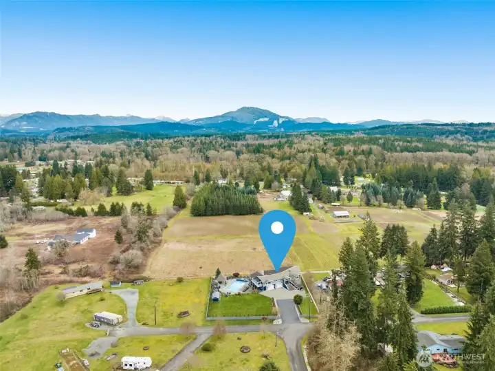 Aerial view capturing the home’s scenic surroundings and open landscape.