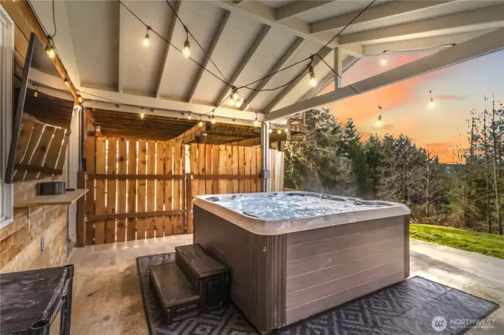 Private hot tub patio at twilight.