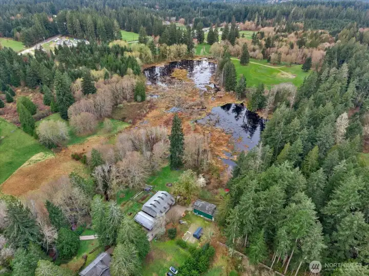 A little over 7 acres with 3 buildings and 1 barn
