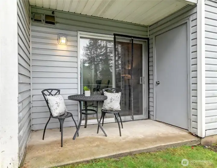 Enjoy coffee or cocktails on your private patio overlooking green space and pond