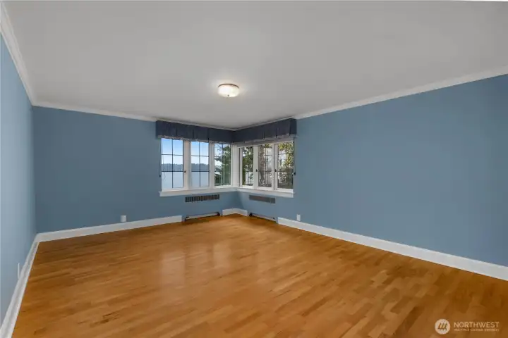 BR 4 -A bright corner setting with glimpses of Eld Inlet adds warmth and character to this spacious upper-level room.