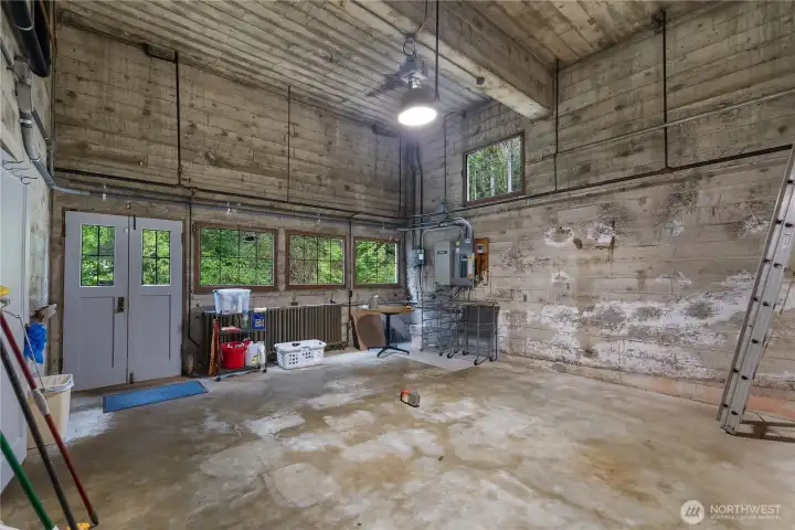 Heated Workshop in Daylight basement under garage - High-capacity utility and shop space adds tremendous function with room for tools, hobbies, workshop use, and more.