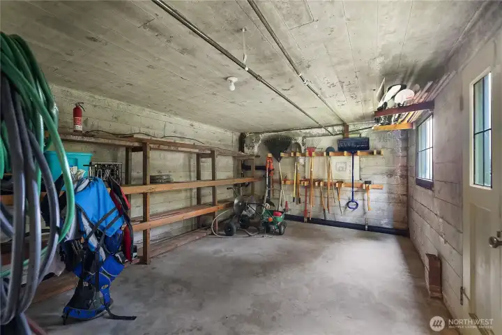 Daylight Sub-Basement opens to the yard and WF - Substantial utility and storage space adds practical everyday function for gardening supplies, tools, and recreational gear.