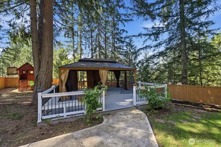Gazebo and play area in backyard