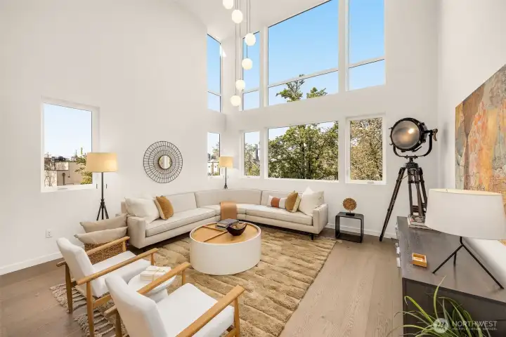 Enter an opulent main floor where massive portrait windows flood the space with light.