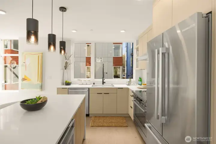 Premium stainless steel suite highlighted by a professional-grade 6-burner gas stove.