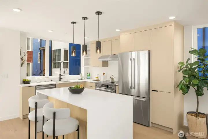 Sleek cabinetry and high-end materials create a masterclass in culinary design.