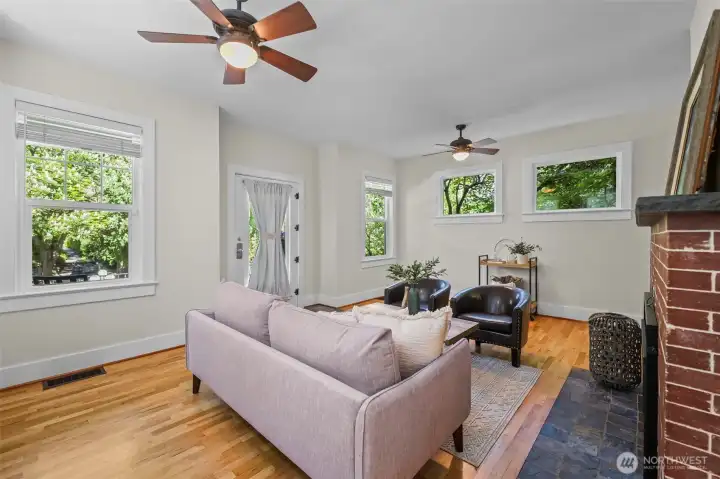 Large craftsman windows frame the tree canopy!