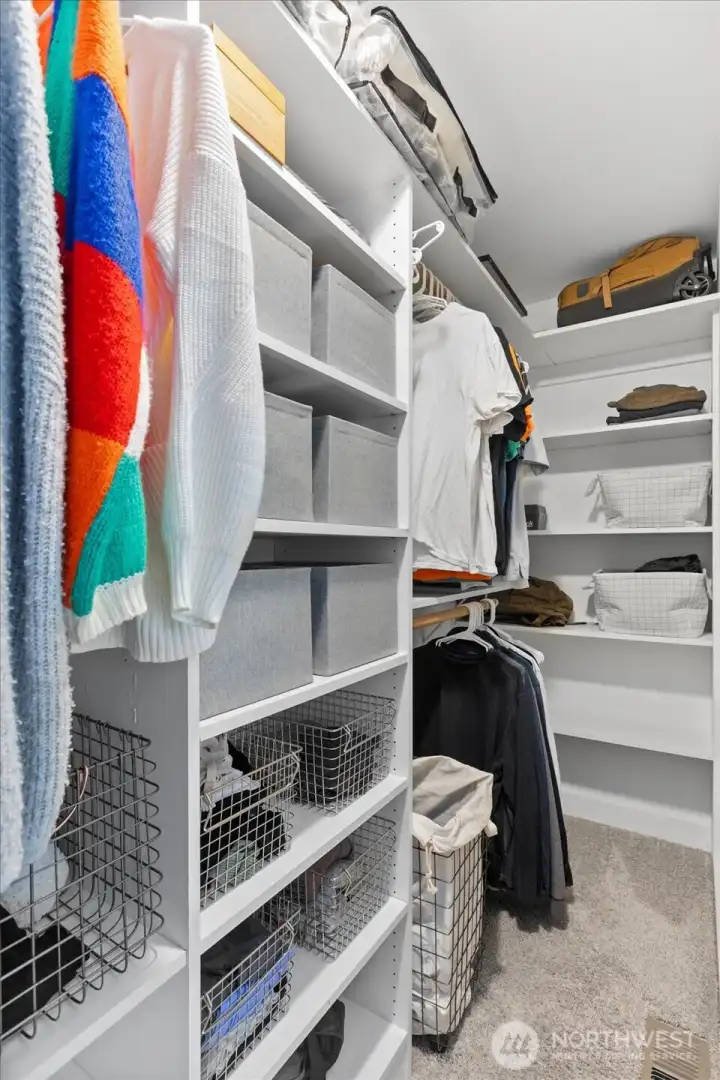 Primary walk-in closet. Primary walk-in closet.