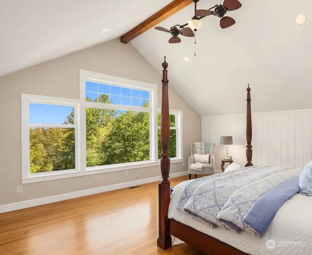 Sunrise Views from the Primary, beam vaulted ceilings, barnwood paneling, ceiling fans and gleaming hardwoods.
