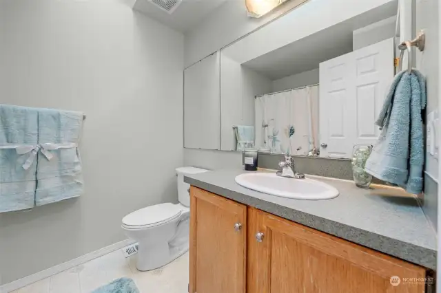 Upstairs main bath is conveniently located to serve bedrooms 2, 3, and 4.