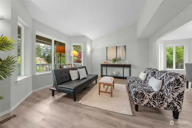 The living area is to the left of entry with large windows offering lots of natural light and beautiful views of the landscaped front yard.  The flooring is throughout most of the main floor.