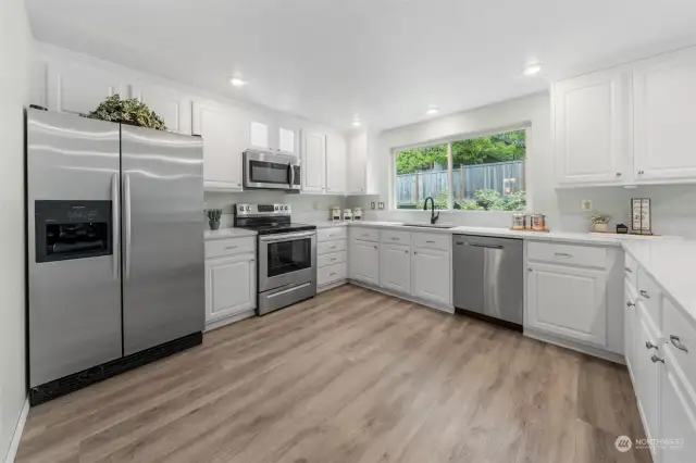 Granite counters, lighted glass front cabinet, plenty of cabinets for all your kitchen needs.  All stainless steel appliance stay with the home.