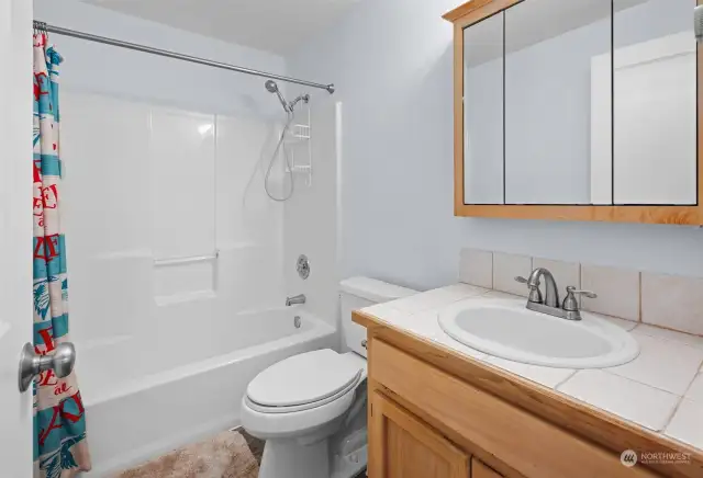 Second full bathroom off the hallway with updated exhaust fan.