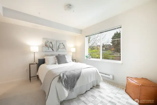 Primary bedroom easily fits a queenn bed!