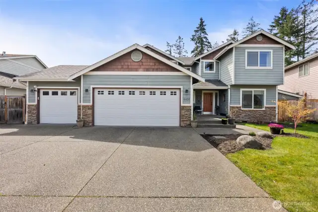 Welcome home! Extra large driveway with gates to the back on the left