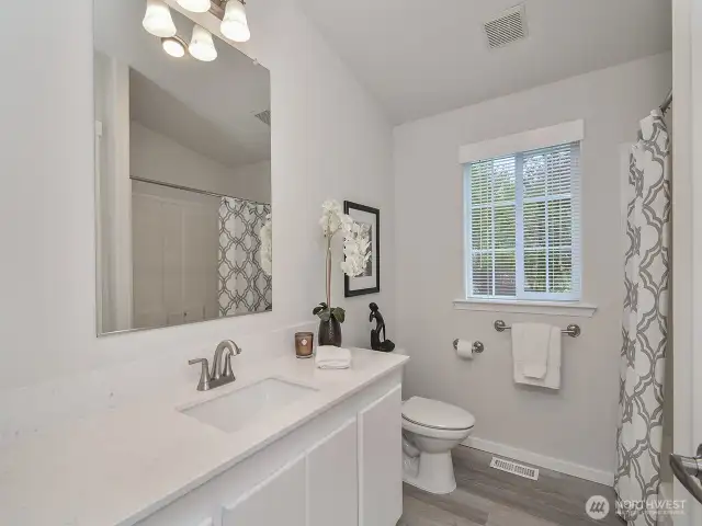 Updated full bathroom servicing the other 2 bedroom.