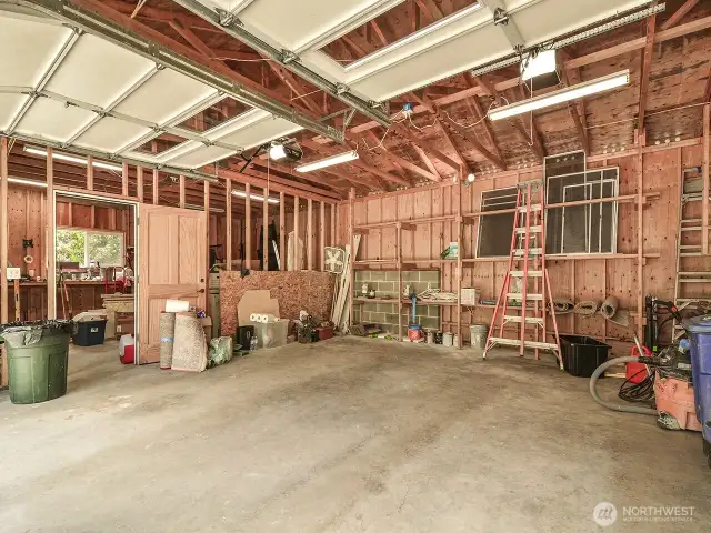 Detached two car garage plus shop area.