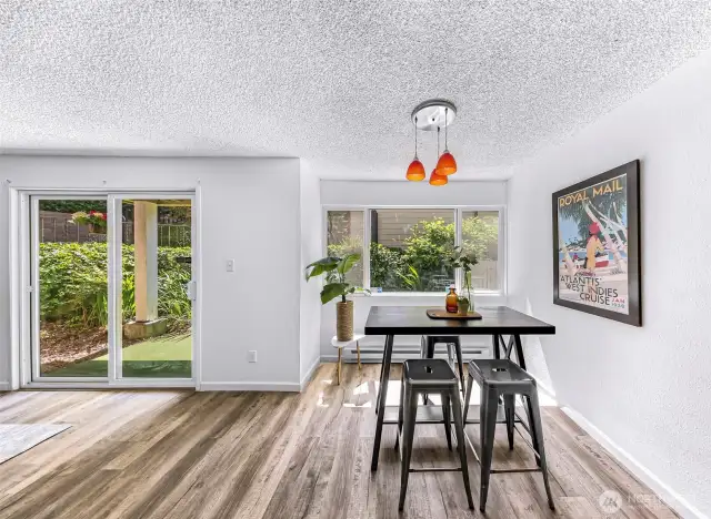 Charming dining area with views of the garden space and patio.