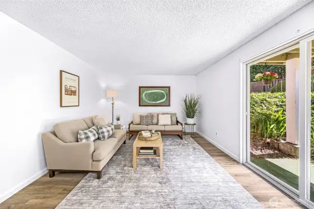 This unit is unique in that is has a larger patio and room for gardening and plants. The large slider allows for an abundance of light to flood in.