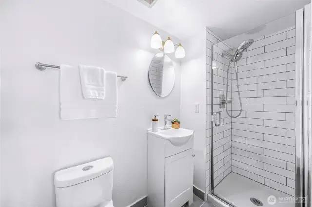 Fully remodeled bathroom in the primary bedroom.
