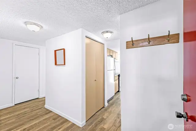 A spacious entryway greets you. The bedrooms are bedrooms are to the left and the kitchen is to your right.