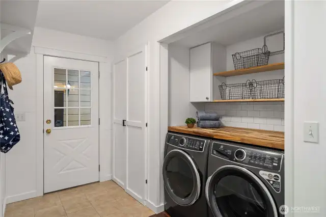 Laundry room w/ folding table, storage & hanging racks