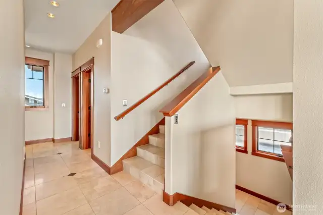 Main Level Hallway: Up to Owner's Suite, down to lower level