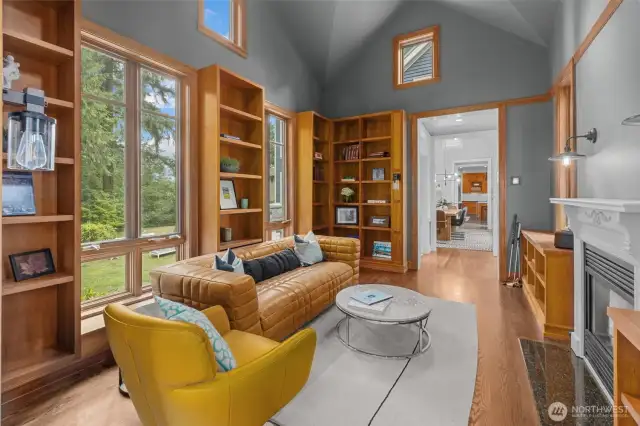 Library room with gas fireplace and built in solid wood shelving