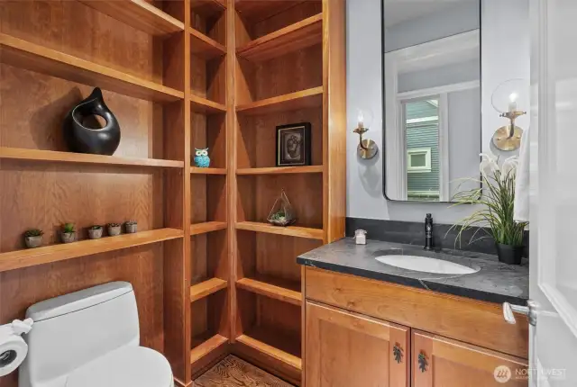 half bath on main level with built in solid wood shelving