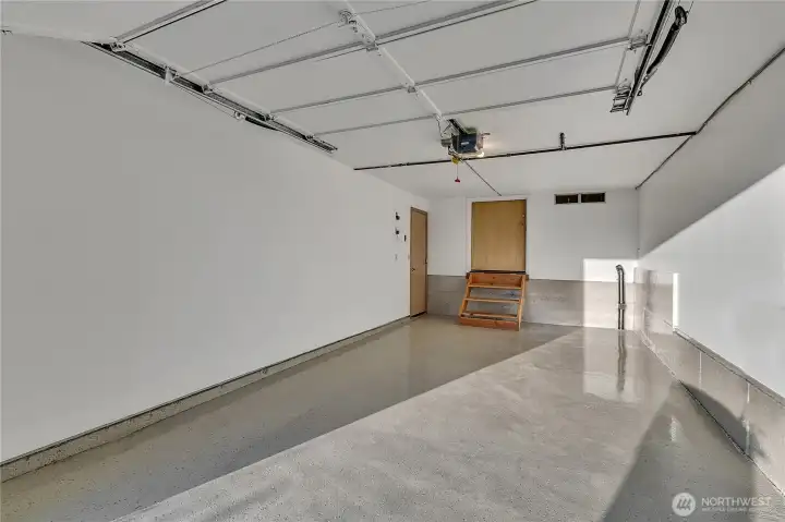The "wood shelving" is really fold down steps and behind that is a hidden entry door to a fully finished storage space!