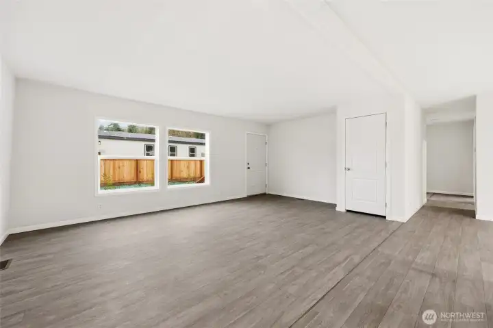 Main entrance with two large windows. Nice and bright. Coat closet at the entry.