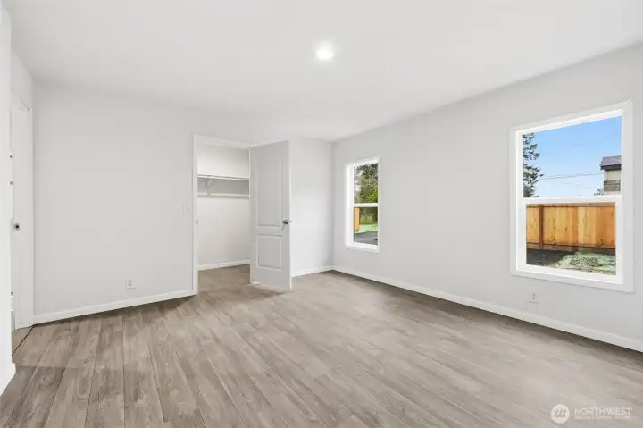 Just off the main living space is the primary bedroom. The primary is a split set up. All other bedrooms are on the other side of the home.