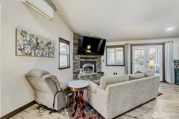 Cozy gas fireplace in the living room. Recessed lighting and open to the kitchen. Mini split for A/C and heat.