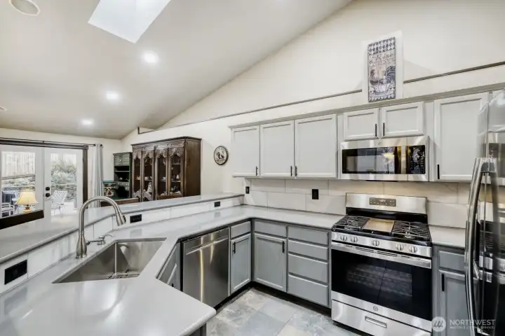 Newer spacious kitchen w/ quartz countertops, walk in pantry and a lot of storage room! Houses fixtures and lights are all new.