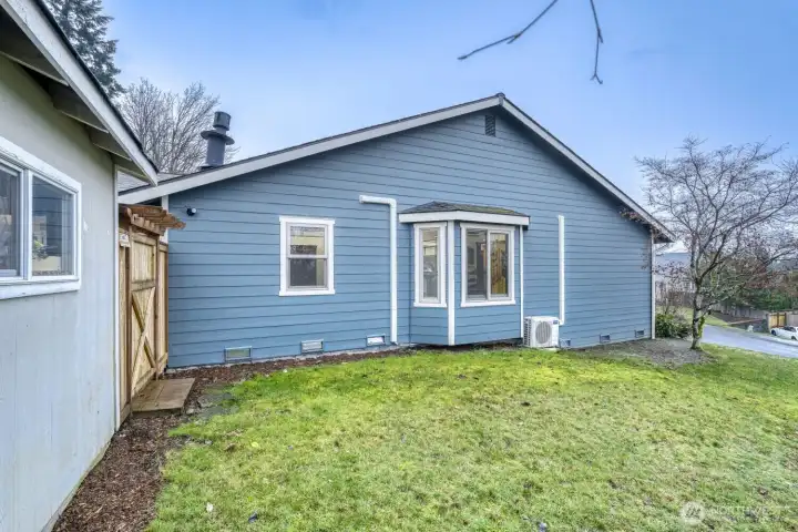 Exterior side of the house and shed.