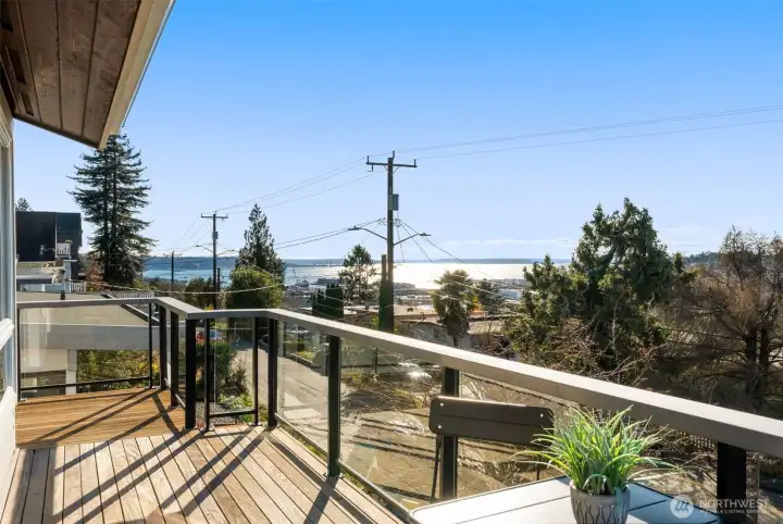 Step onto the west-facing deck for sunset views, or head to the back deck—perfect for BBQs, outdoor movie nights, and easy evenings with friends.