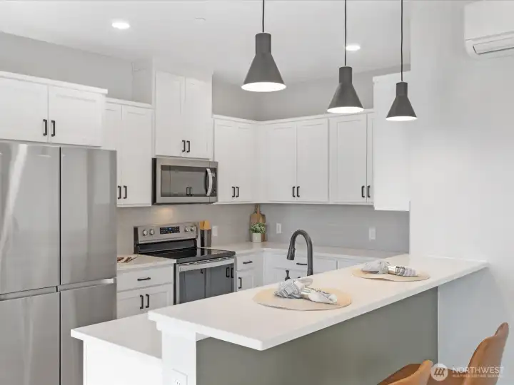 Kitchen features a large island for dining.