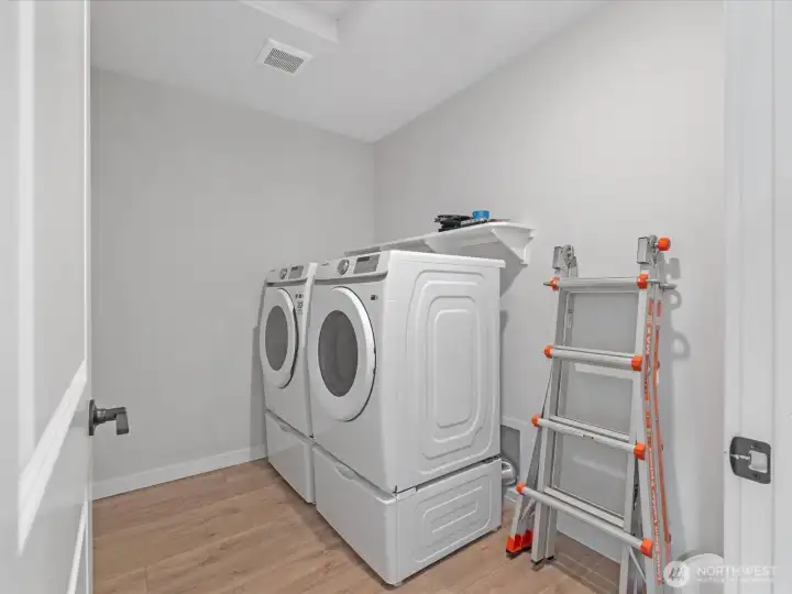 Convenient upper floor laundry room.