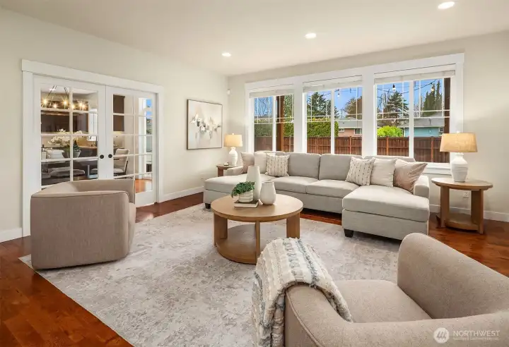 Light filled family room with pocket doors leading to kitchen.