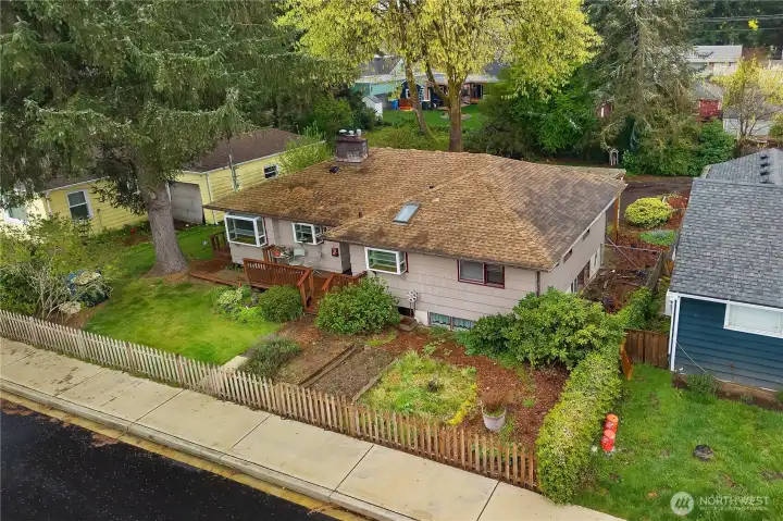 Take in the setting from above and see the home’s yard, deck, and neighborhood position.